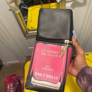 Pink and black nail polish purse